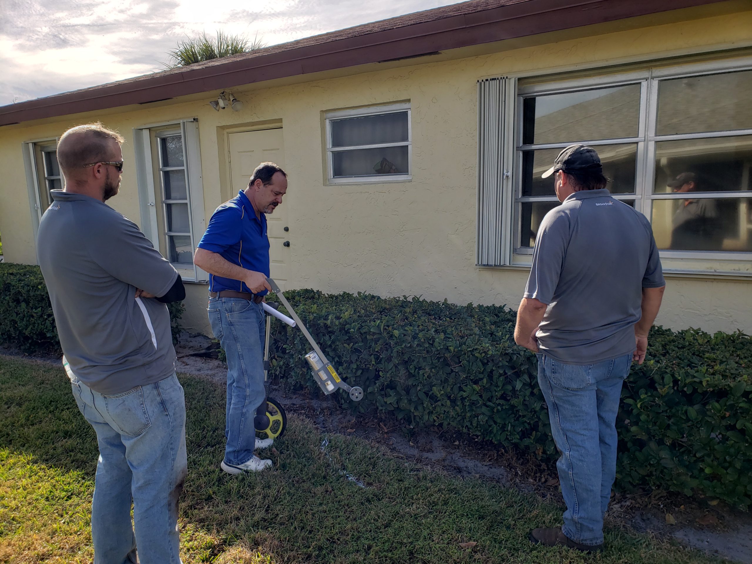 BroadStar engineer marking entry points for Fiber to Home Network.