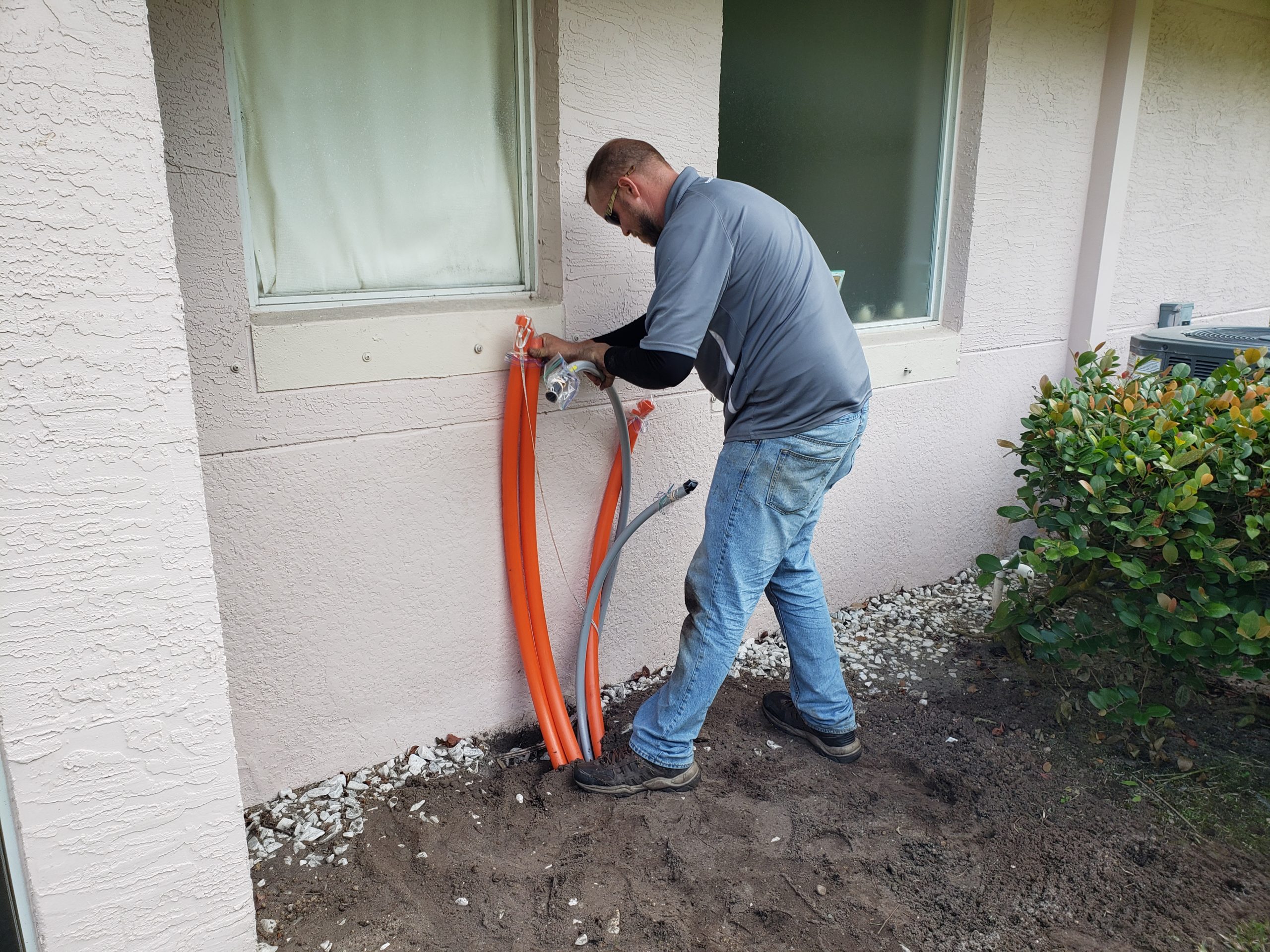 BroadStar Technician inspecting conduit.